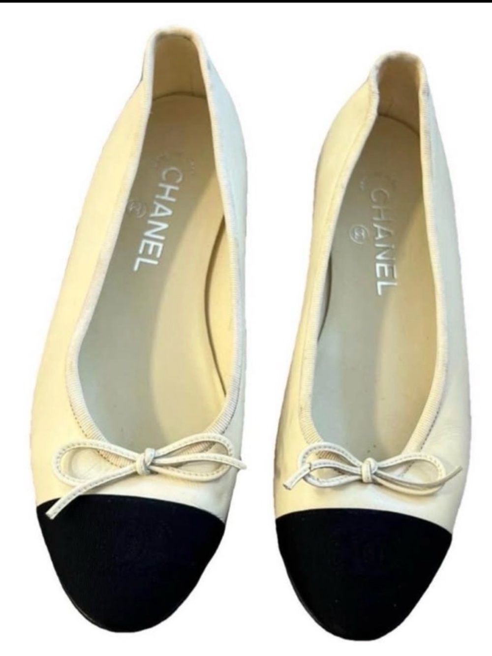CHANEL Ivory Leather Ballet Flats with Black Cap Toes